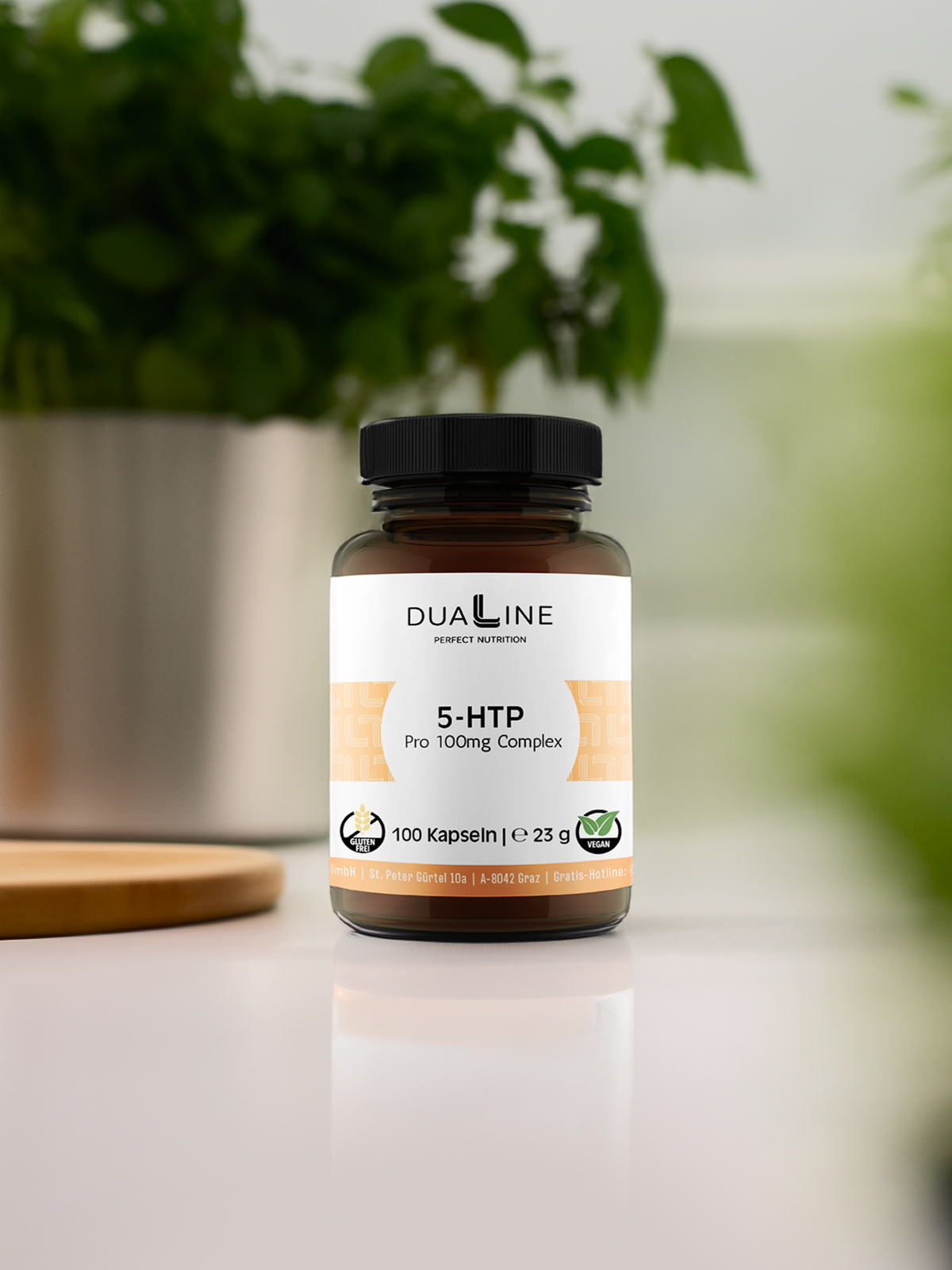 Eine Dose DUALINE 5-HTP - Pro 100mg Complex, Unterstützung bei Heißhungerattacken, auf einem Tisch