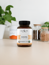 Eine Dose DUALINE Curcuma - Pro Vitality Complex auf einem Tisch