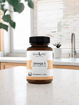 Eine Dose DUALINE Omega 3 - Pur Omega Power auf dem Tisch, unterstützt den Fettstoffwechsel