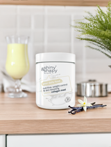 In einer Küche eine Dose Shiny&Shapy Vanille und ein Shake zum Abnehmen